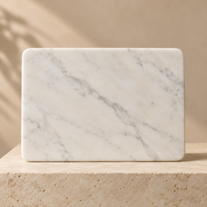 V White marble cheese and chopping board on a neutral pedestal