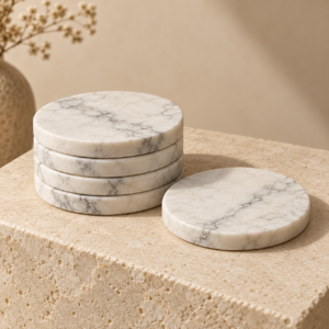 Four V White marble tea coasters in a premium neutral setting